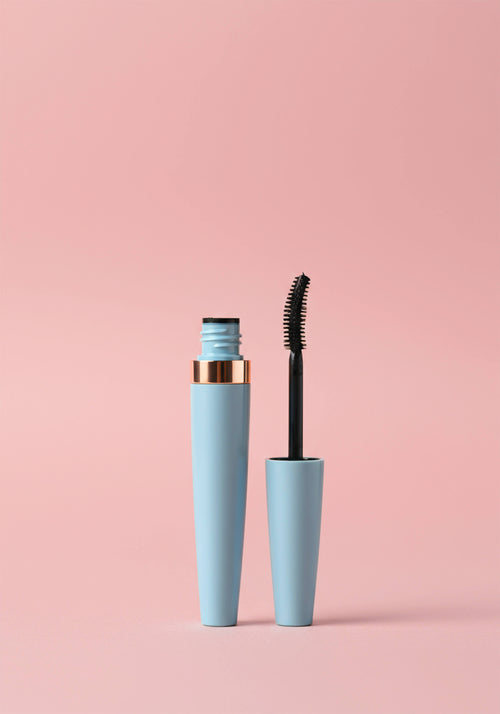 Load image 1 in gallery view. A blue mascara tube with a gold rim. Comes with a standard plastic mascara wand.