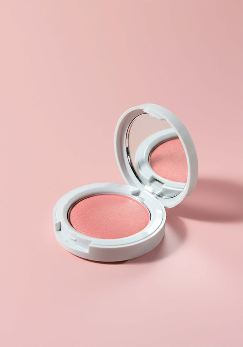 Load image 1 in gallery view. A peachy blush in a round white plastic compact.